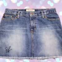 asta-maglione-gonna-jeans-autografati-lucia-bronzetti